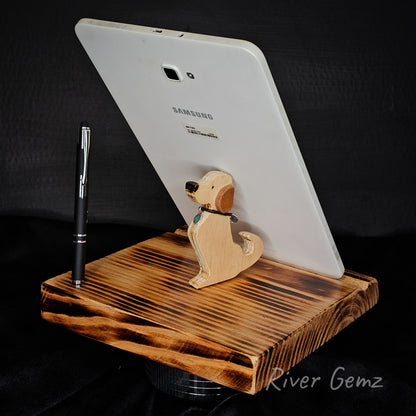 Wooden tablet stand with a dog-shaped phone holder and a Samsung tablet on a dark background.