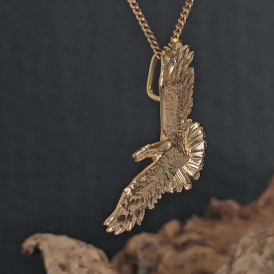 Video showing the yellow gold eagle pendant rotate 180 degrees.