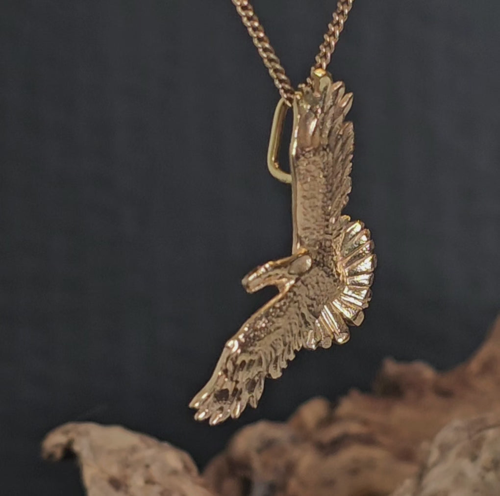Video showing the yellow gold eagle pendant rotate 180 degrees.