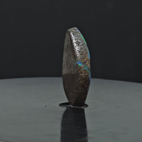 Video showing loose opal standing upright rotating 200 degrees.