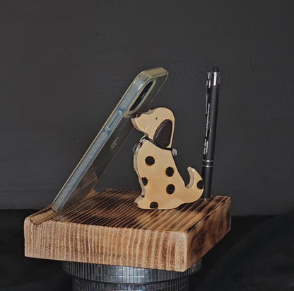 Wooden tablet stand with spotted dog and pen shown to rotate 180 degrees.