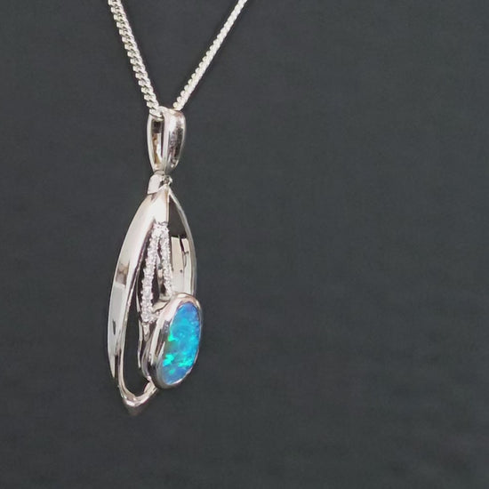 Video showing the high quality pendant rotate to reveal all sides including the back to show ironstone of the boulder opal.