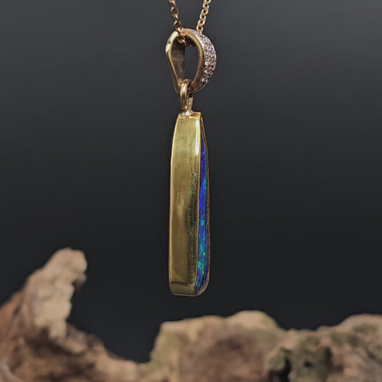Video showing the boulder opal and gold pendant rotate to reveal views of all sides.