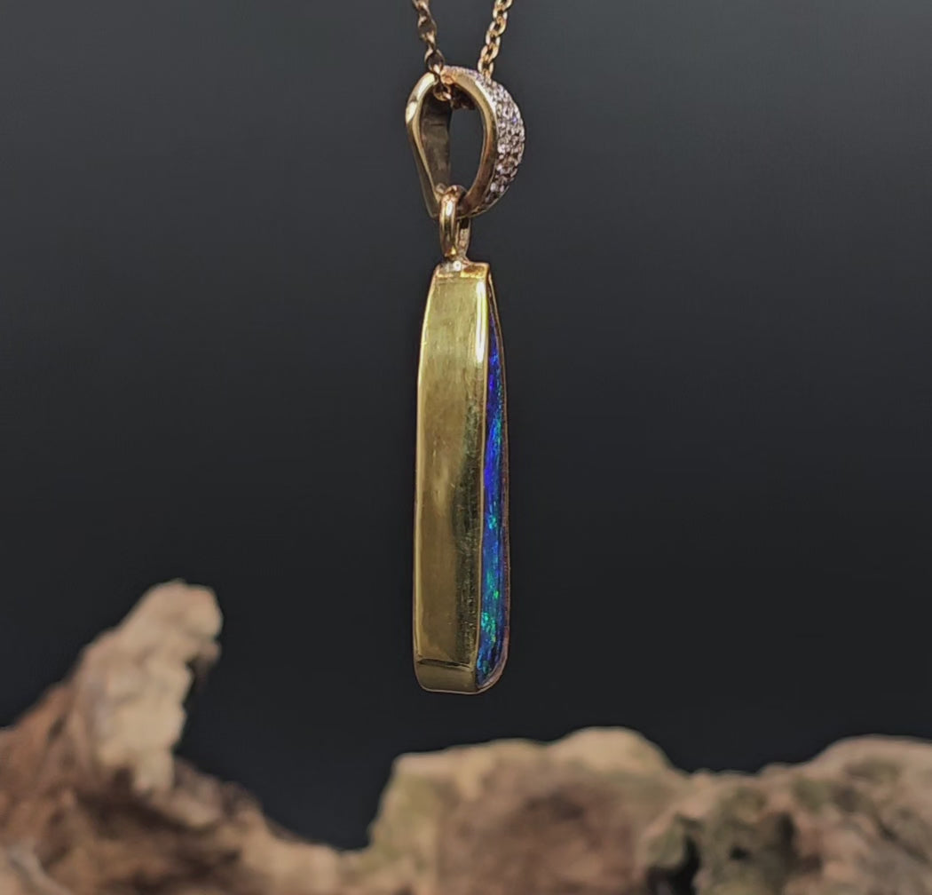 Video showing the boulder opal and gold pendant rotate to reveal views of all sides.