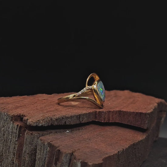 Video showing the opal and diamond engagement ring rotate 200 degrees.