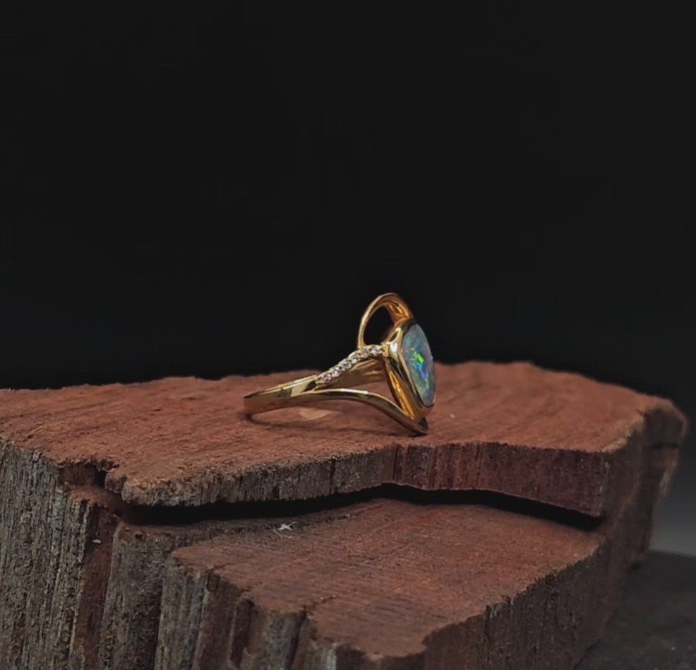 Video showing the opal and diamond engagement ring rotate 200 degrees.