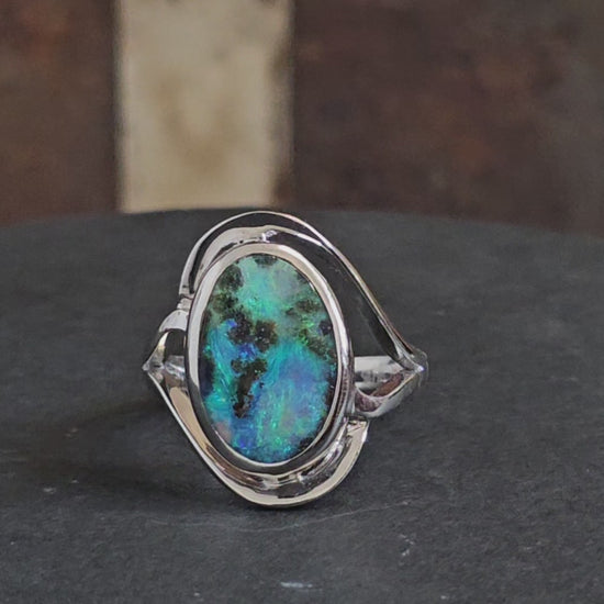 Video showing boulder opal sterling silver ring rotate to reveal front and rear views.