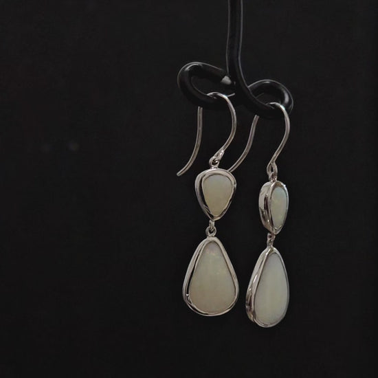 Two milky opals bezel set in each sterling silver French hook earring.