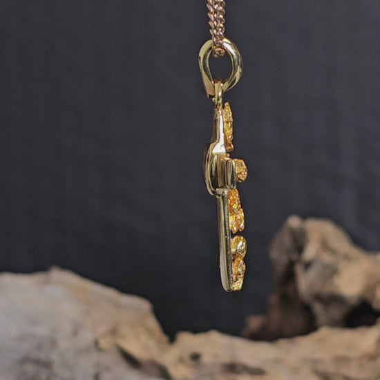 Video showing gold nugget cross necklace rotate 200 degrees.
