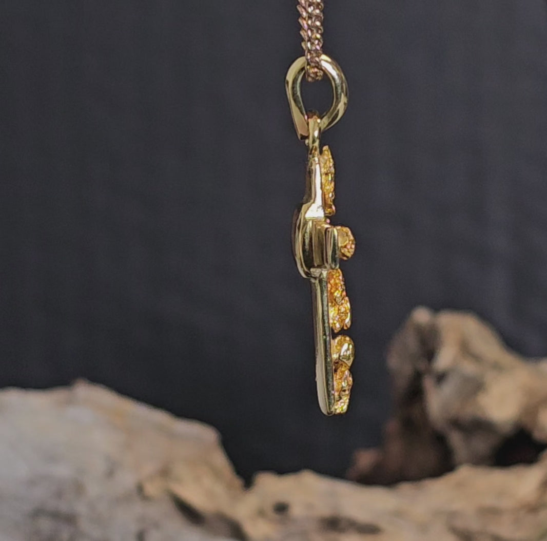 Video showing gold nugget cross necklace rotate 200 degrees.