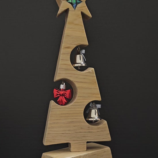 Video showing wooden Christmas tree rotate 360 degrees.