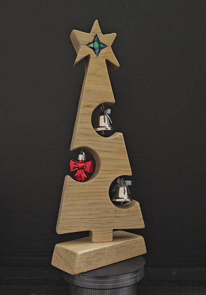 Video showing wooden Christmas tree rotate 360 degrees.