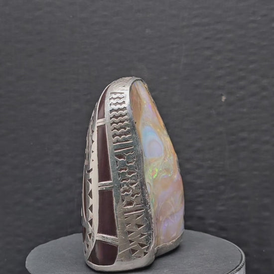 Video showing the ornament consisting of a boulder opal specimen and sterling silver kangaroo surround rotating 360 degrees.