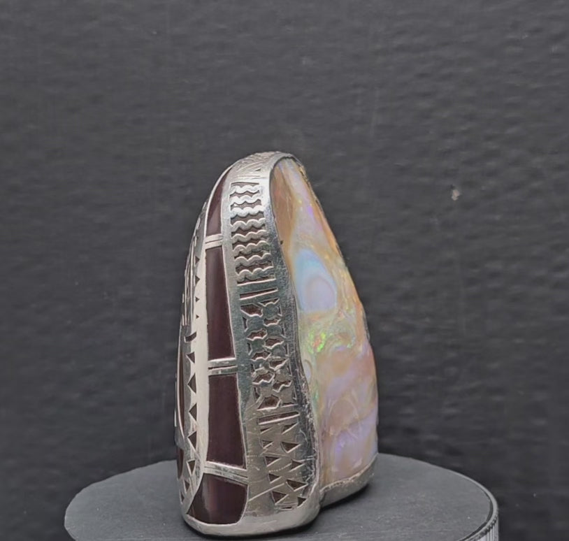Video showing the ornament consisting of a boulder opal specimen and sterling silver kangaroo surround rotating 360 degrees.