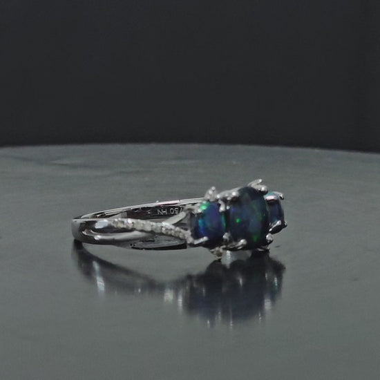 180 degree rotational video of tri-opal and diamond white gold ring.