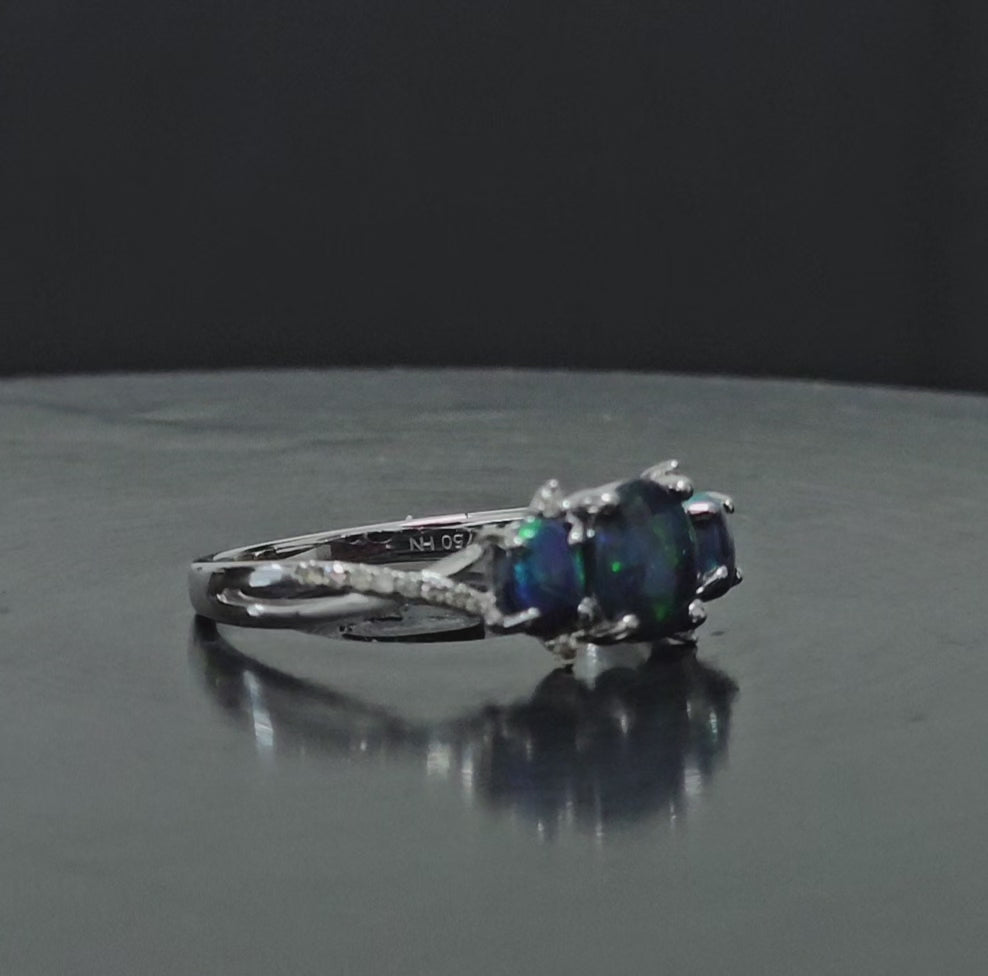 180 degree rotational video of tri-opal and diamond white gold ring.