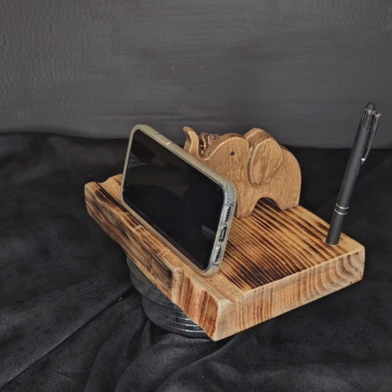 Video showing gold elephant phone-tablet  stand with a phone rotate.
