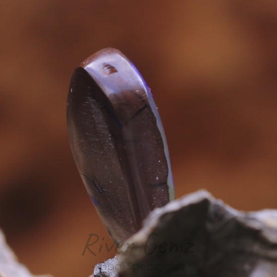 Video shows a 180 degree rotation of the solid boulder opal.