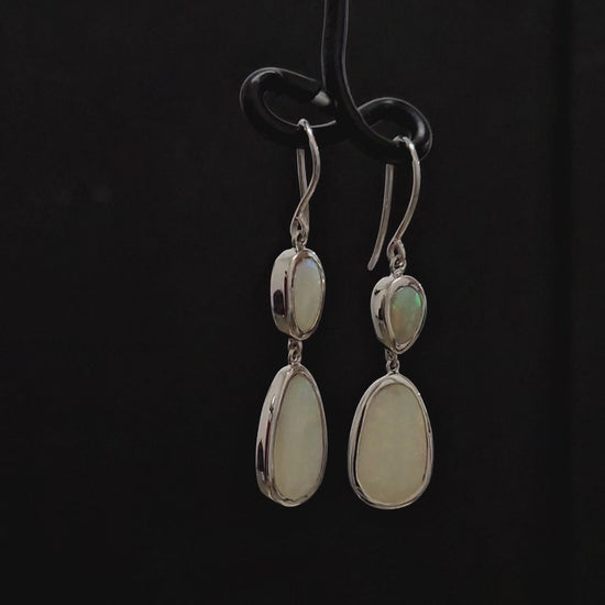 Two light opals in each silver shepherd hook.