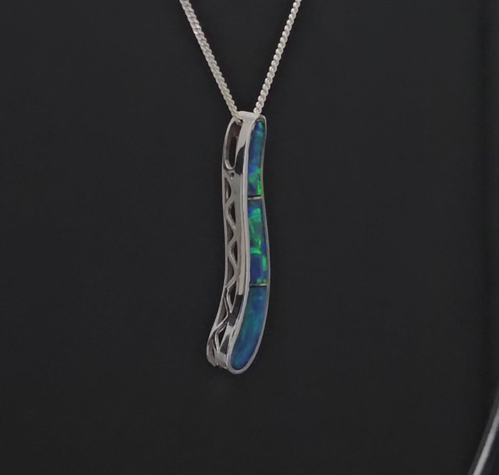 Long thin elongated s-shaped necklace with 3 green opals in white gold.