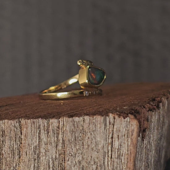 Video showing the black opal and diamonds ring rotate 180 degrees.