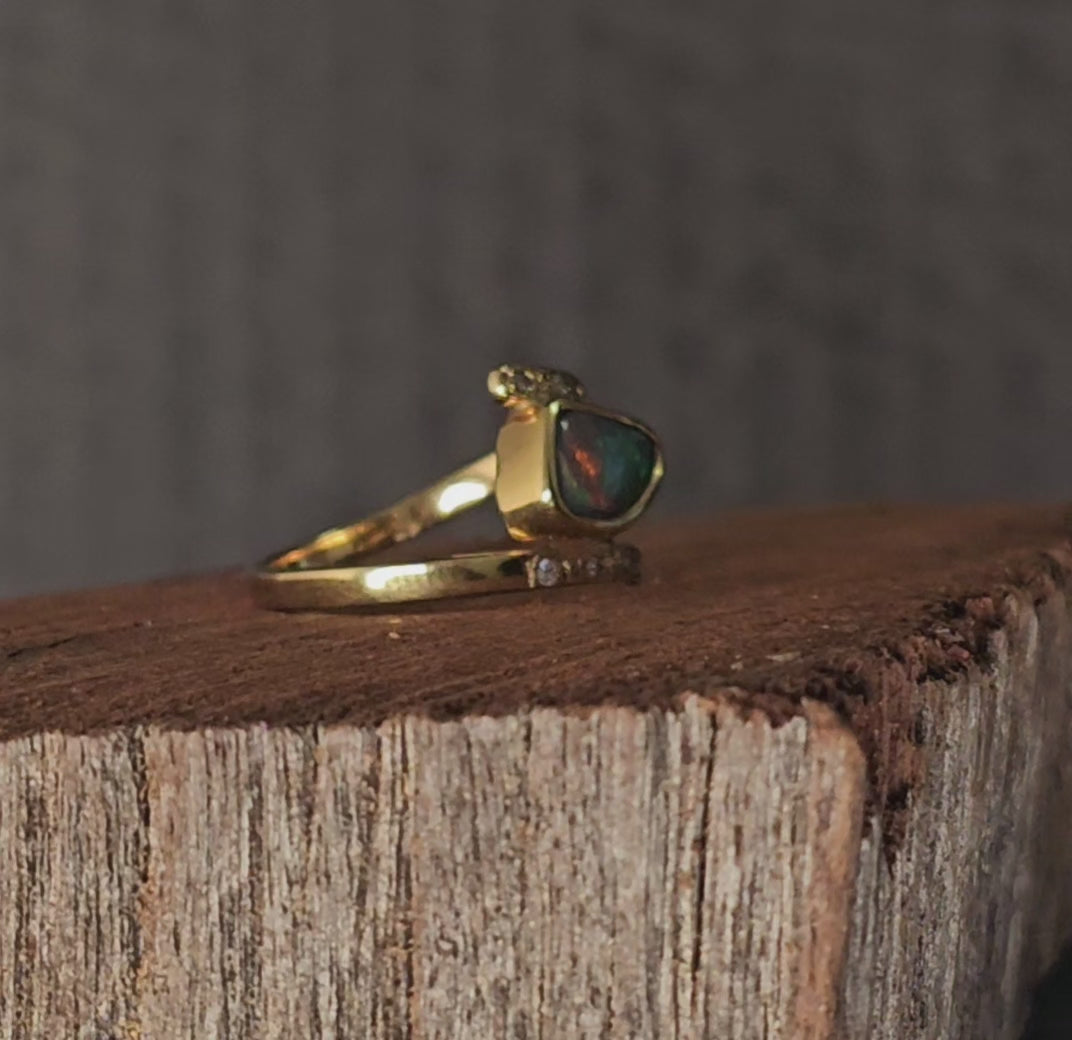 Video showing the black opal and diamonds ring rotate 180 degrees.