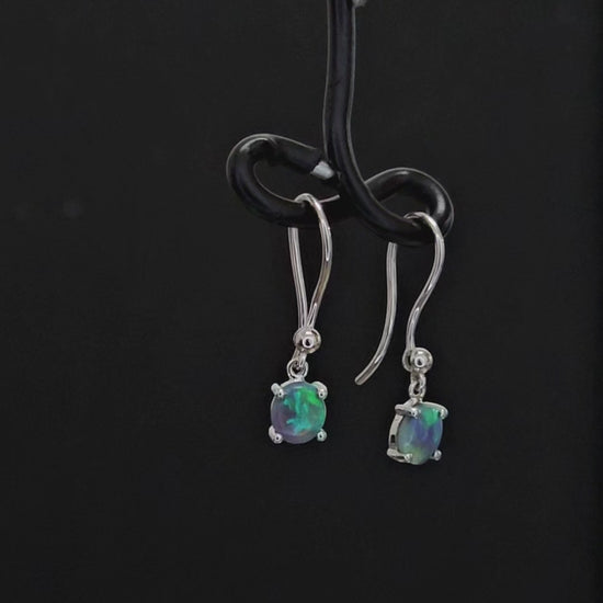 Dark opals claw set in silver shepherd hooks.