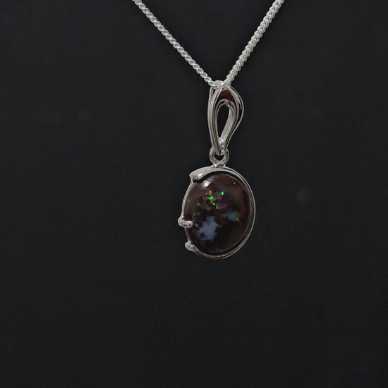 Dark based opal with multi-coloured veins in petite silver necklace.