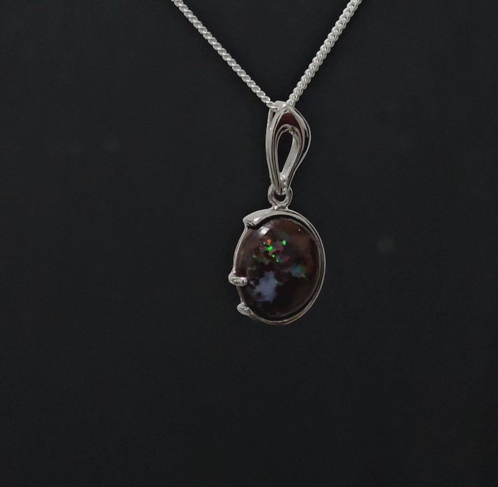 Dark based opal with multi-coloured veins in petite silver necklace.