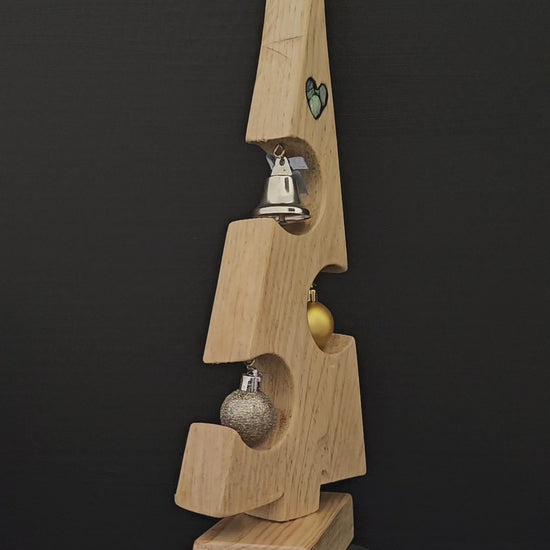 Video showing the small wooden Christmas tree rotating to show a 360 degree view.