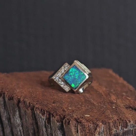 Video showing the white gold, crystal opal and diamond ring rotate 200 degrees.