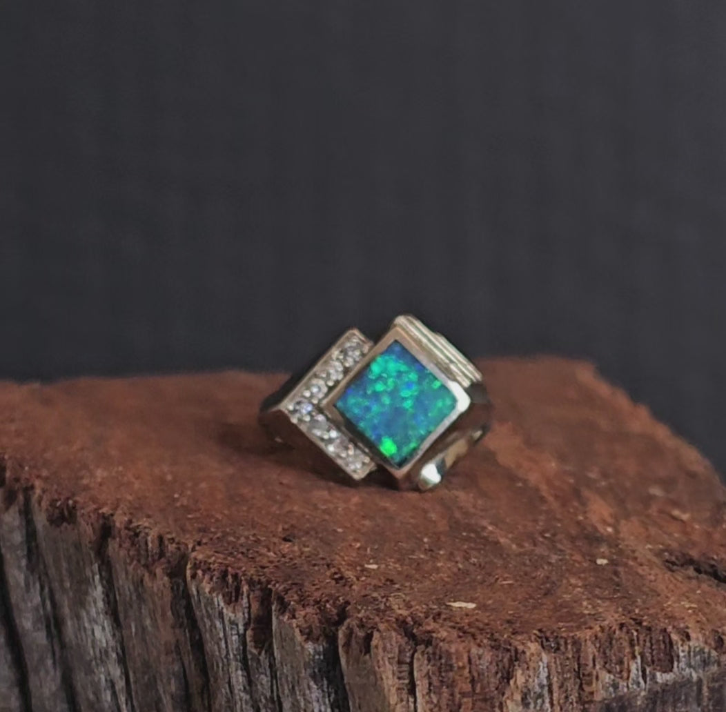 Video showing the white gold, crystal opal and diamond ring rotate 200 degrees.