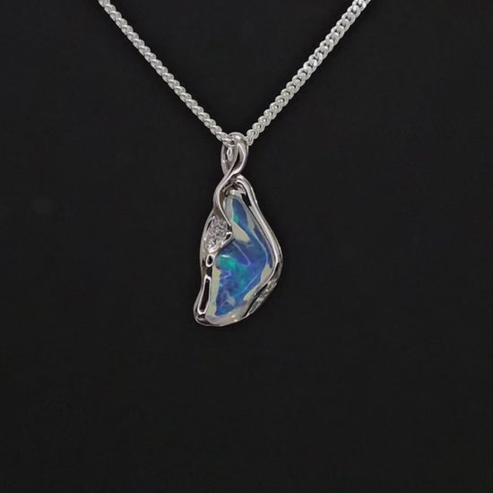 Unusually shaped white gold necklace with translucent opal and small diamonds.