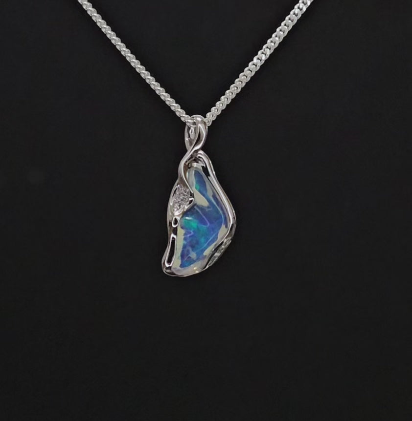 Unusually shaped white gold necklace with translucent opal and small diamonds.