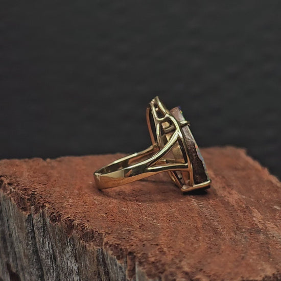 Video showing the boulder opal gold ring rotate 200 degrees.