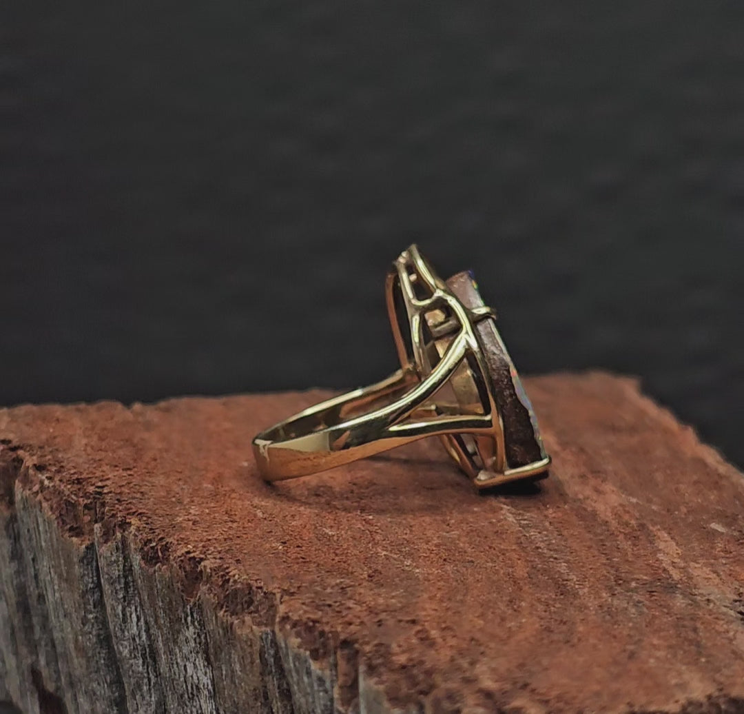 Video showing the boulder opal gold ring rotate 200 degrees.